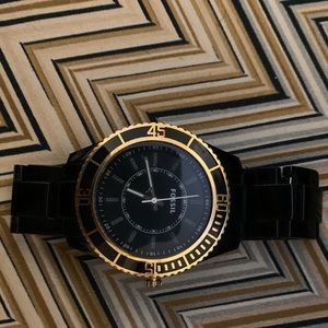 Black and gold Fossil watch
